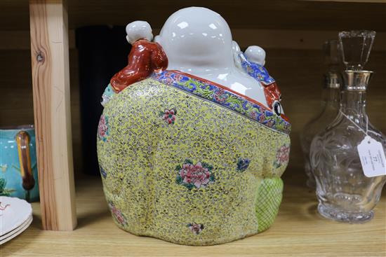 A Chinese enamelled porcelain figure of Budai with attendants height 30cm